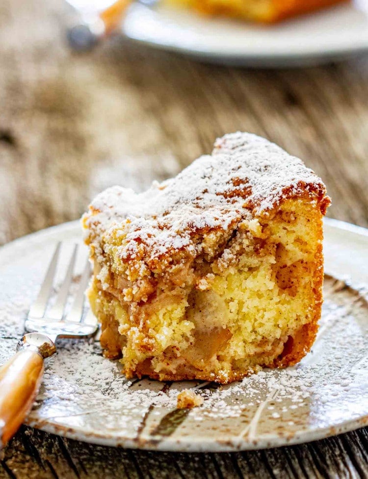 a slice of apple pie cake on a plate.