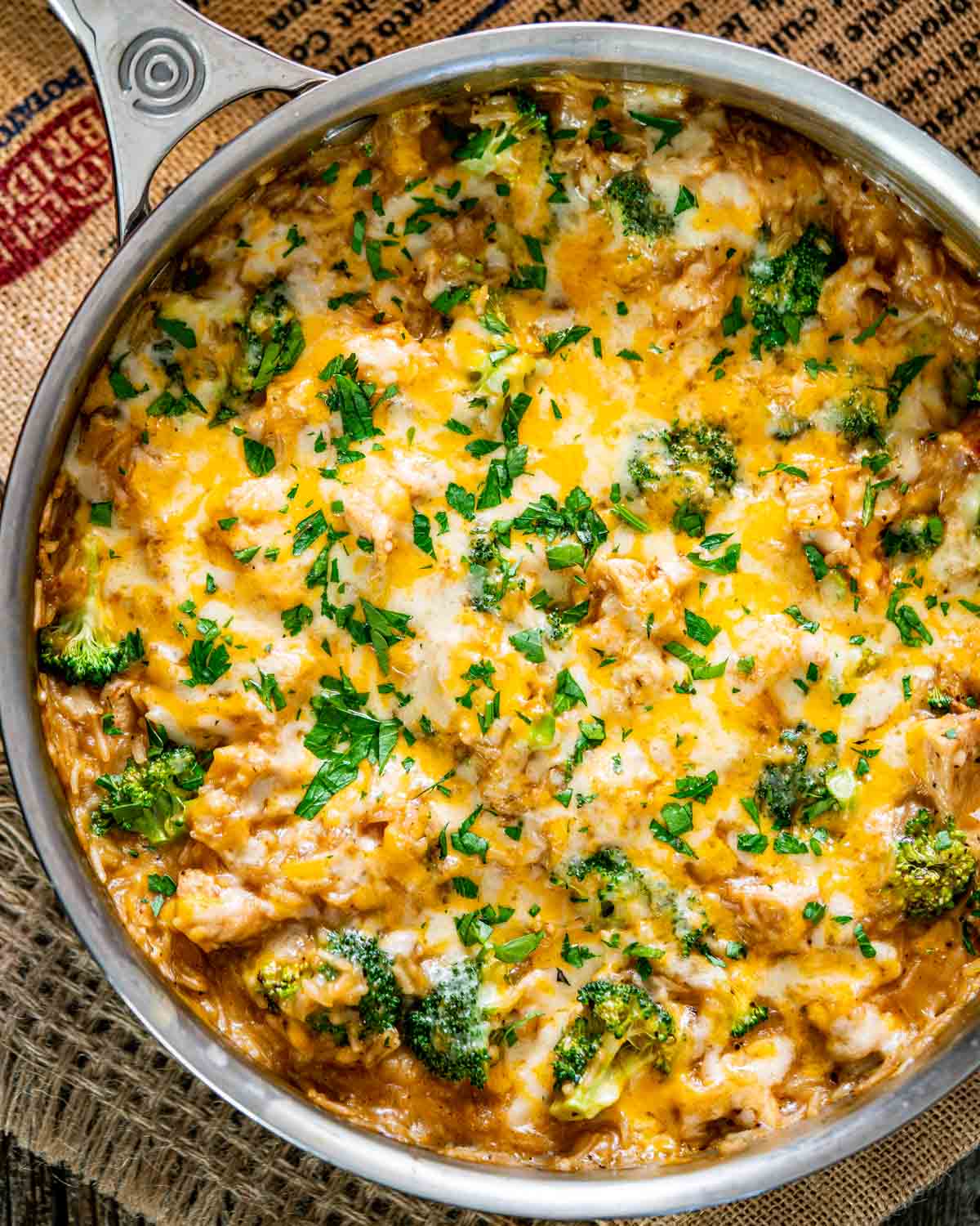 freshly made cheesy chicken broccoli rice casserole in a skillet.