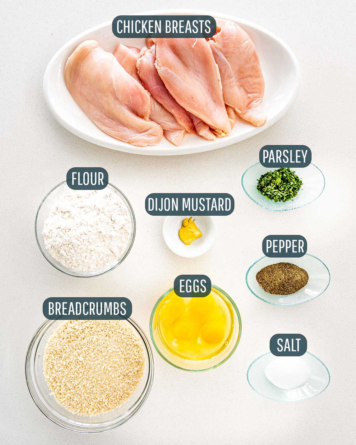 overhead shot of ingredients needed to make chicken schnitzel.