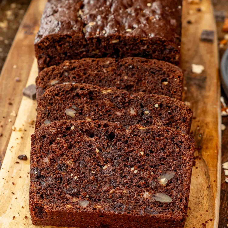 sliced chocolate banana bread on a cutting board.