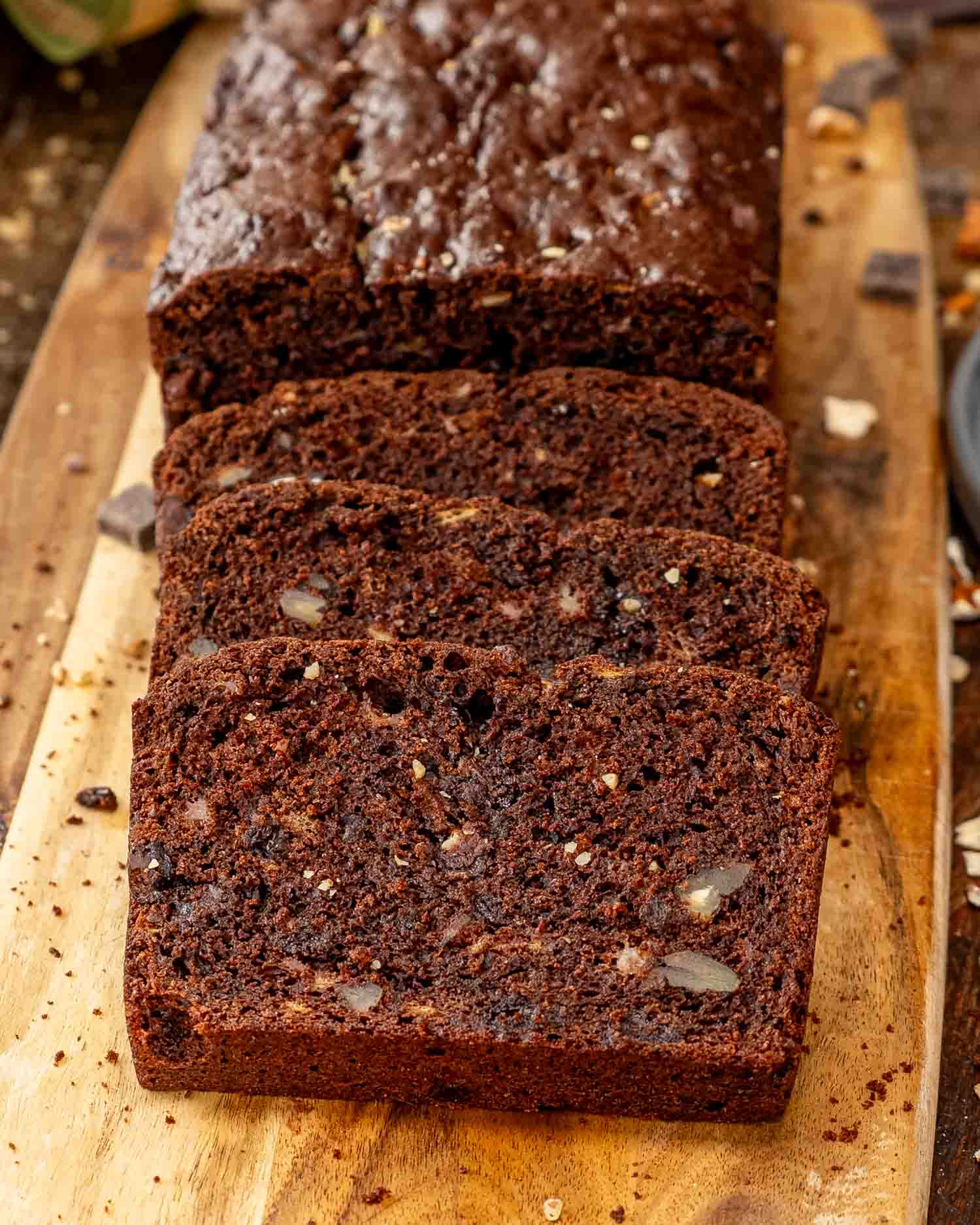 sliced chocolate banana bread on a cutting board.