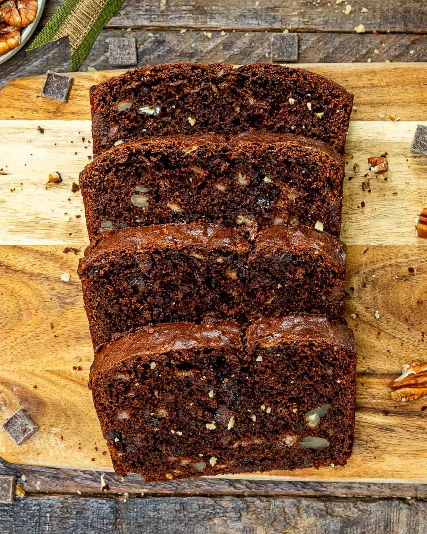 sliced chocolate banana bread on a cutting board.