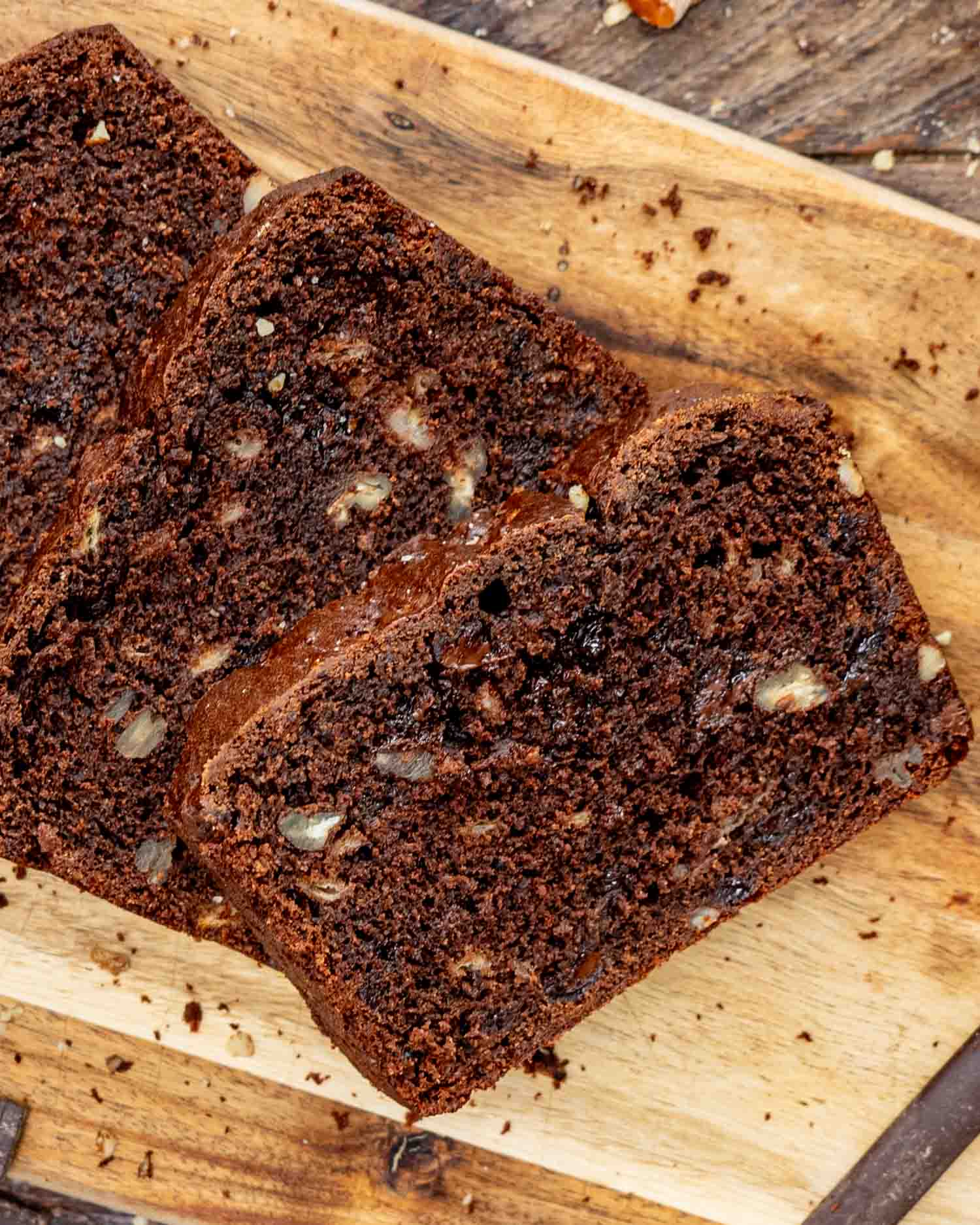 sliced chocolate banana bread on a cutting board.