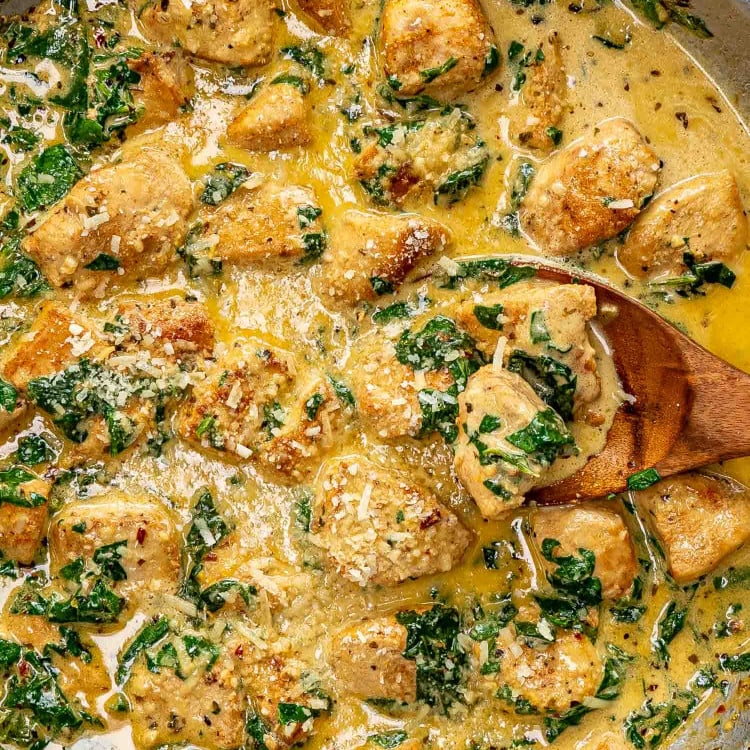 freshly made creamy butter lemon chicken in a stainless skillet.