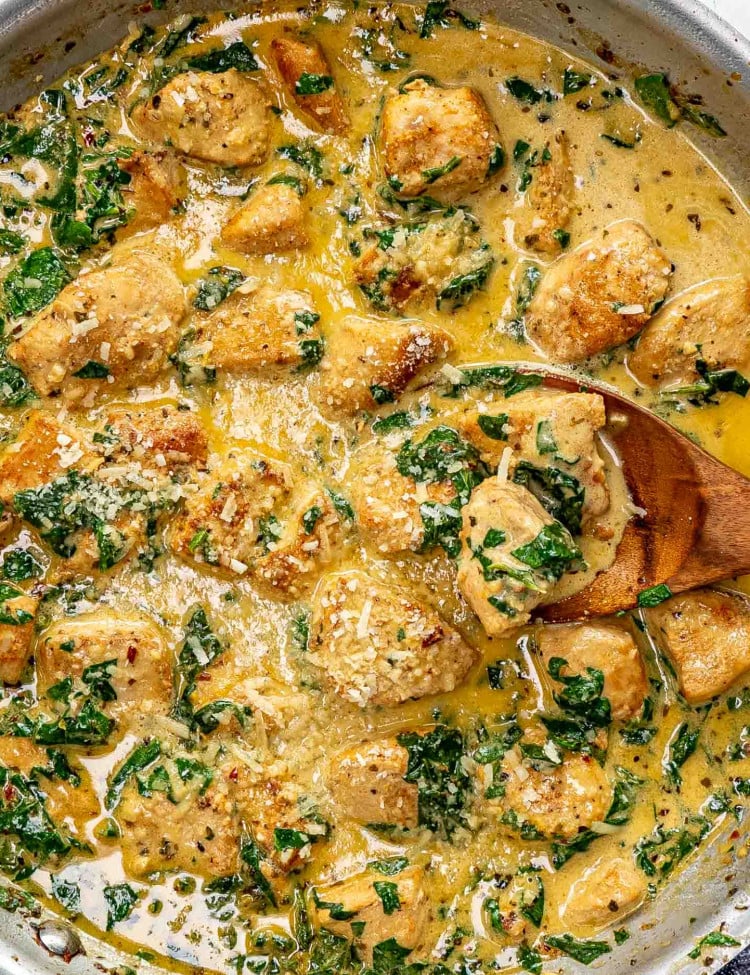 freshly made creamy butter lemon chicken in a stainless skillet.