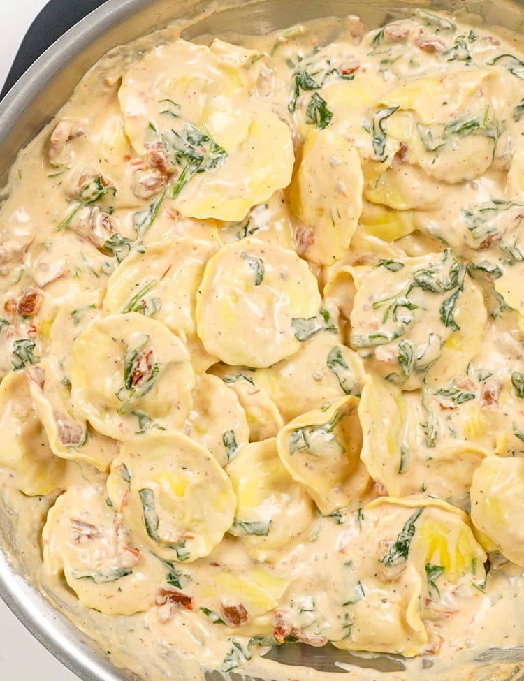 freshly made creamy ravioli in a skillet.