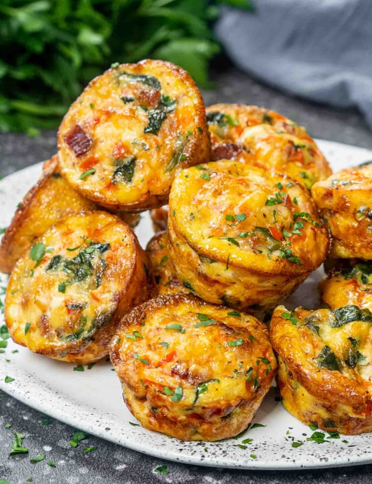 a bunch of egg muffins on a platter.