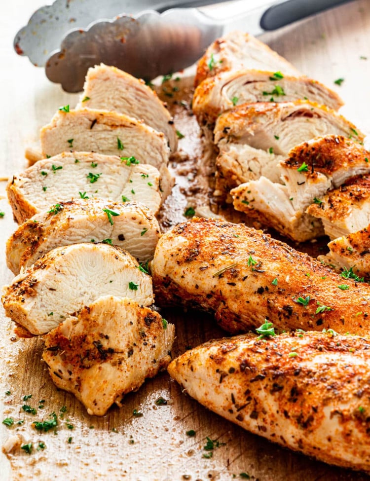 sliced instant pot chicken breasts on a cutting board