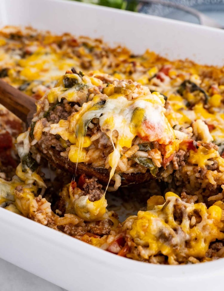 mexican beef and rice casserole in a white casserole dish.