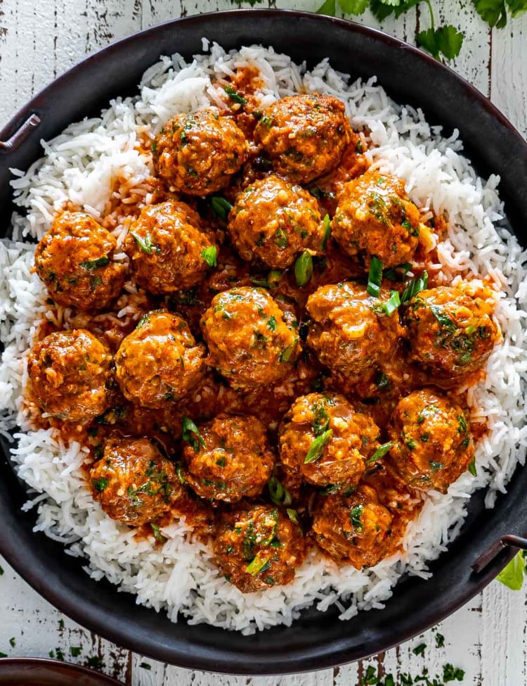 red curry turkey meatballs over a bed of rice.