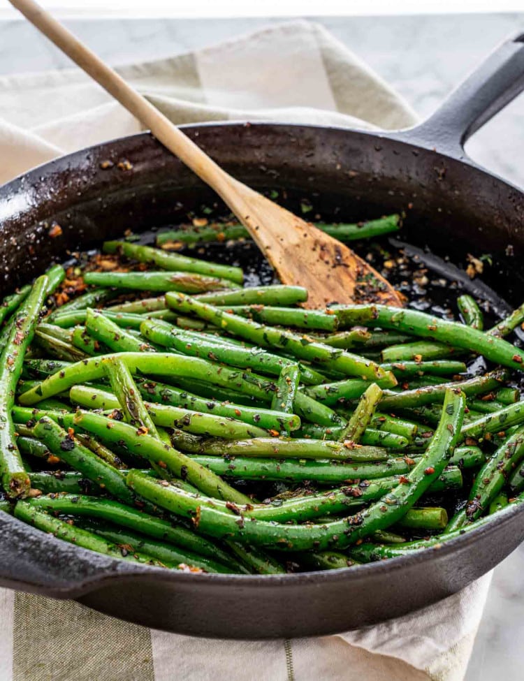 freshly made skillet green beans in a black cast iron skillet.