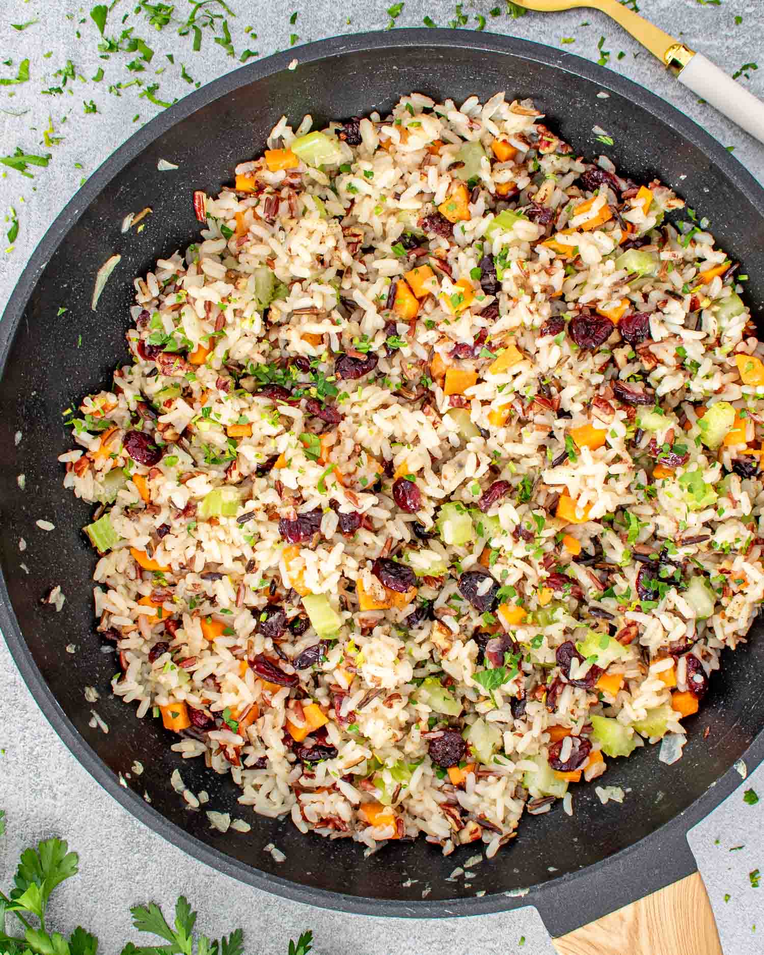 freshly made wild rice pilaf in a skillet.